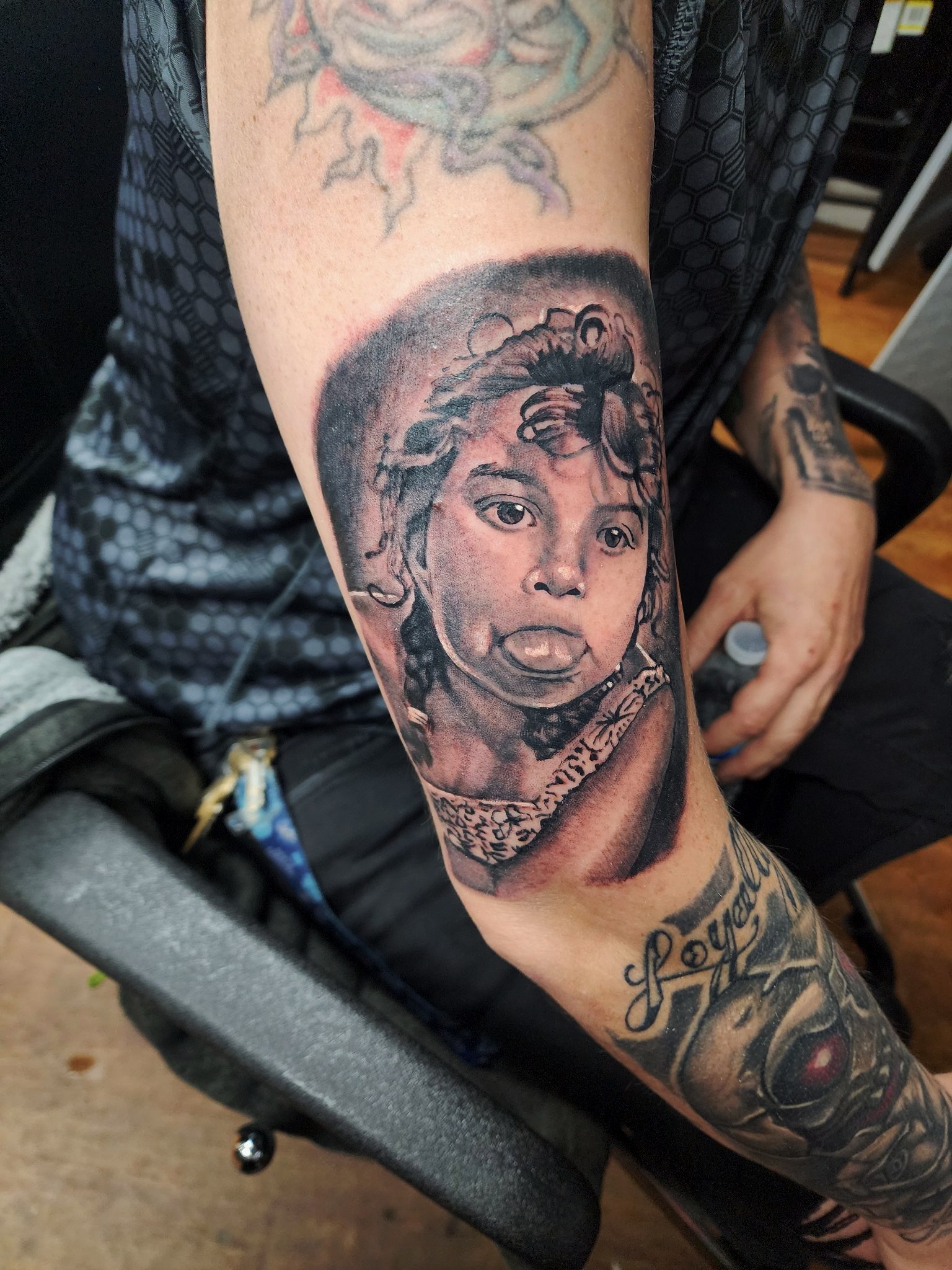 Black and grey portrait tattoo by G Creation Art